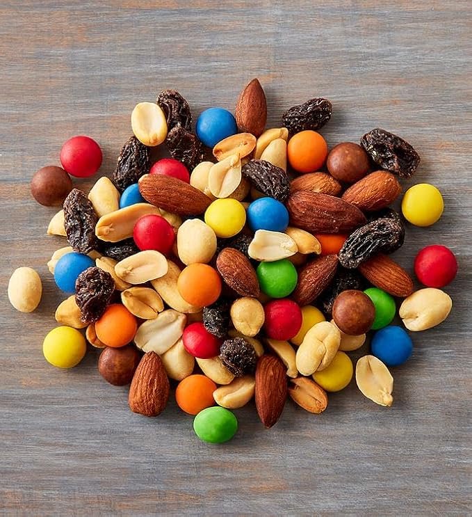 Colorful trail mix with nuts, raisins, and candy pieces from the gift basket.